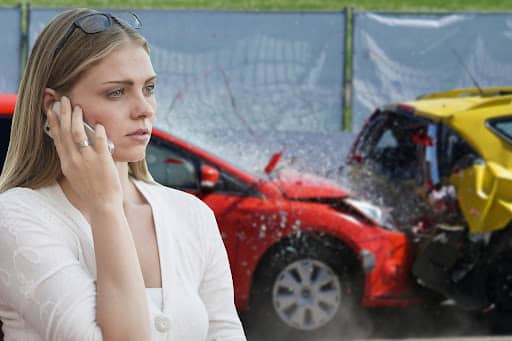 woman on the phone calling insurance agency after a car accident.