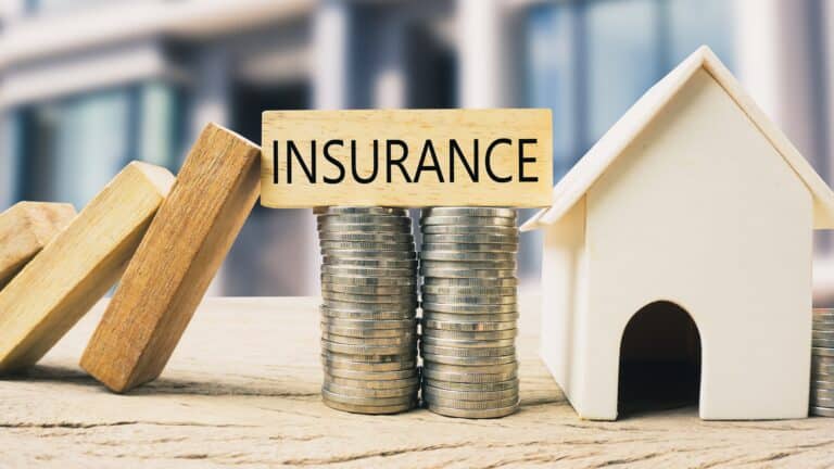 Home insurance coverage concept with a home being protected by insurance