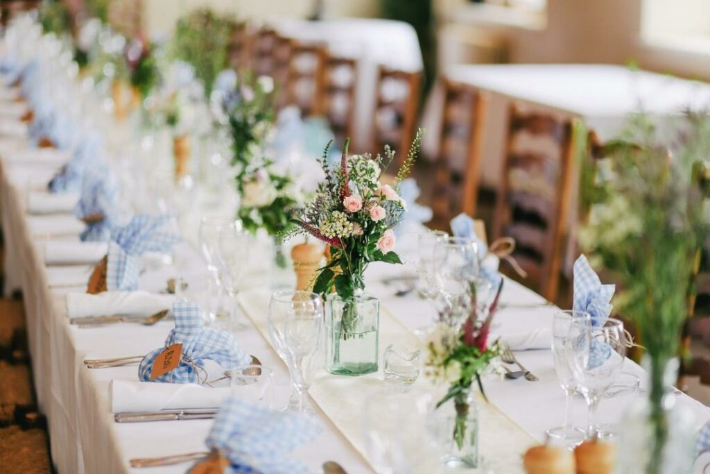 A decorated table with napkins and centerpieces for an event that is covered by event insurance