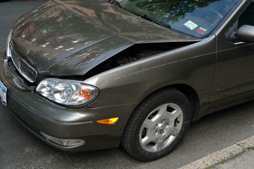 commercial car insurance needed for a crushed car hood