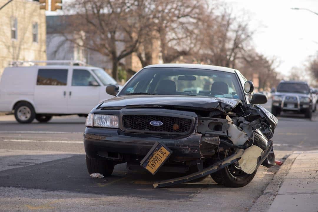 Full coverage car insurance concept with car with lots of damage