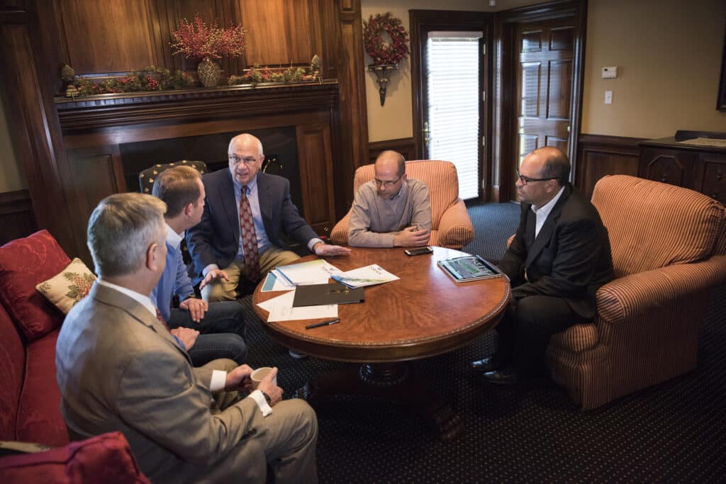 independent insurance agency team discussion at a conference room table