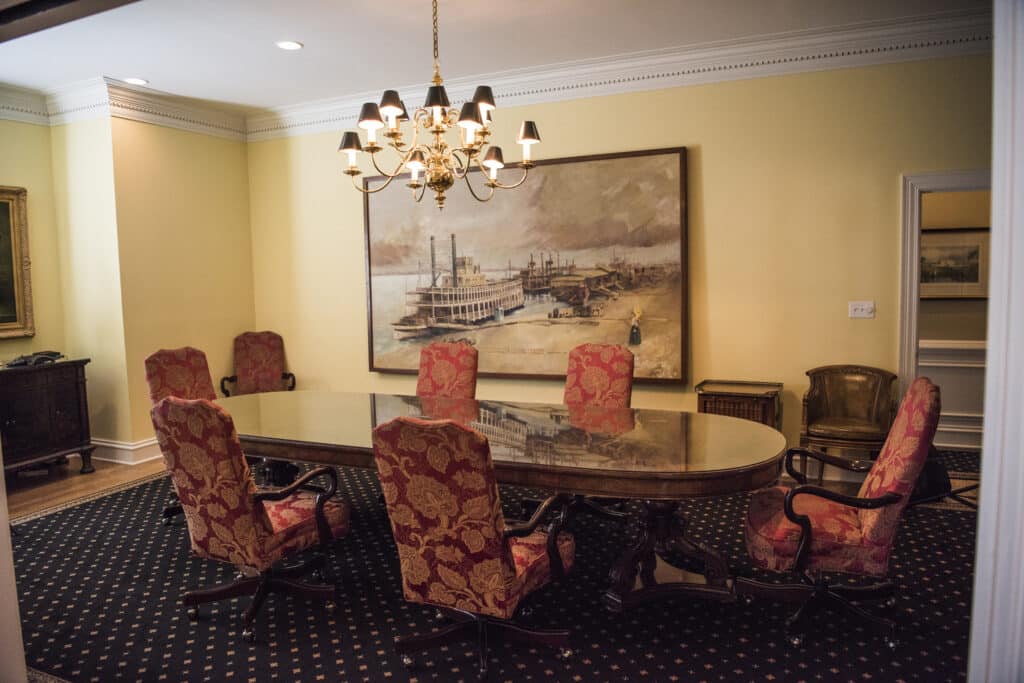 Torian Insurance office with a conference room with an empty conference desk and chairs.