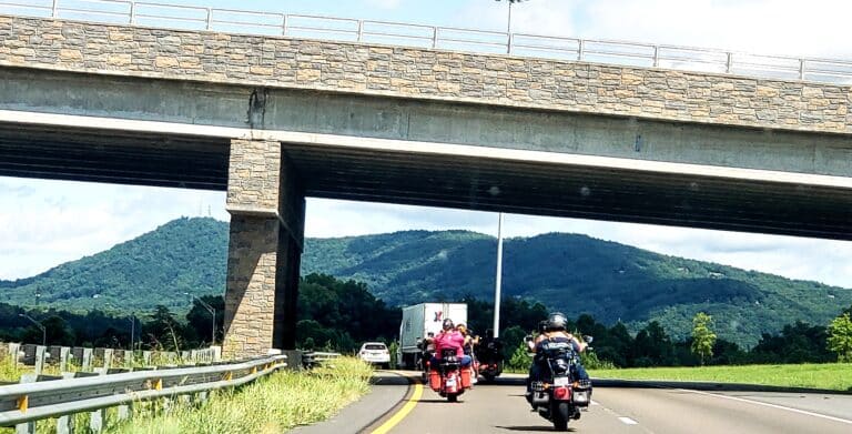 Motorcycle riders driving under a bridge following indiana motorcycle laws