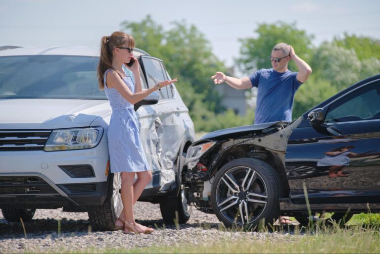 Drivers discussing a car accident and what steps to take next.