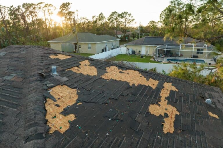 Aerial view of a damaged roof awaiting repair.