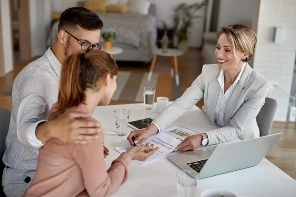 insurance agent helps a couple compare home insurance quotes