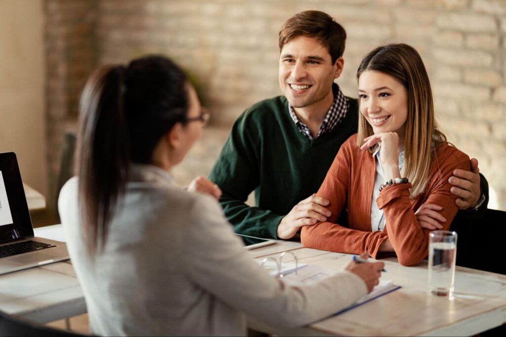 Couple enjoys a friendly consultation in a professional office setting.
