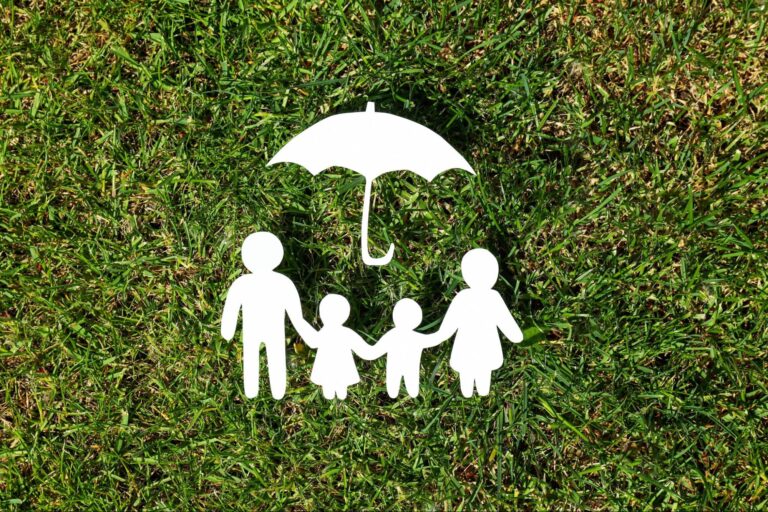 Family Life insurance protection illustration with parents and children under an umbrella.