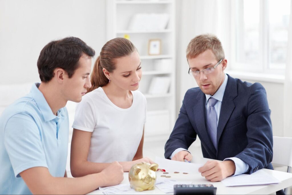 Couple consulting with an expert for effective insurance planning strategies.