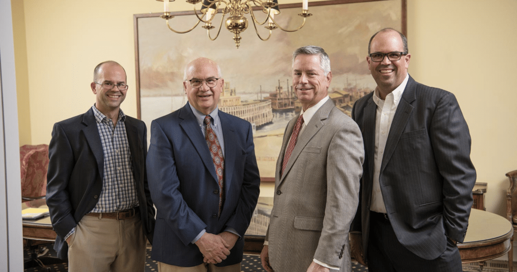 Business leaders collaborating in a modern office setting, showcasing teamwork and professionalism.