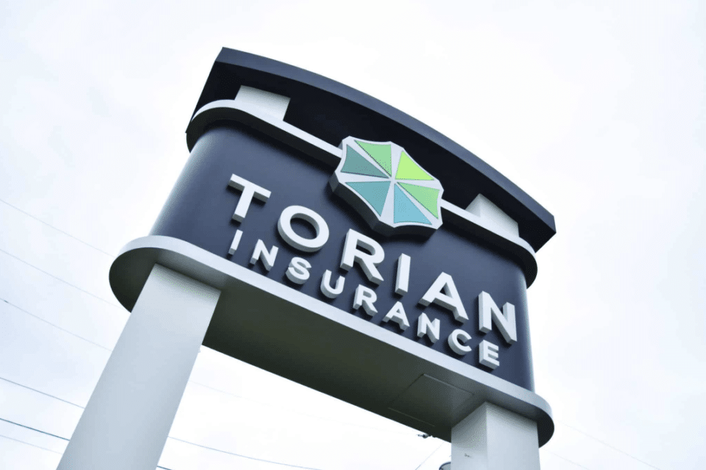 Torian Insurance sign showcasing trust and reliability in coverage options.