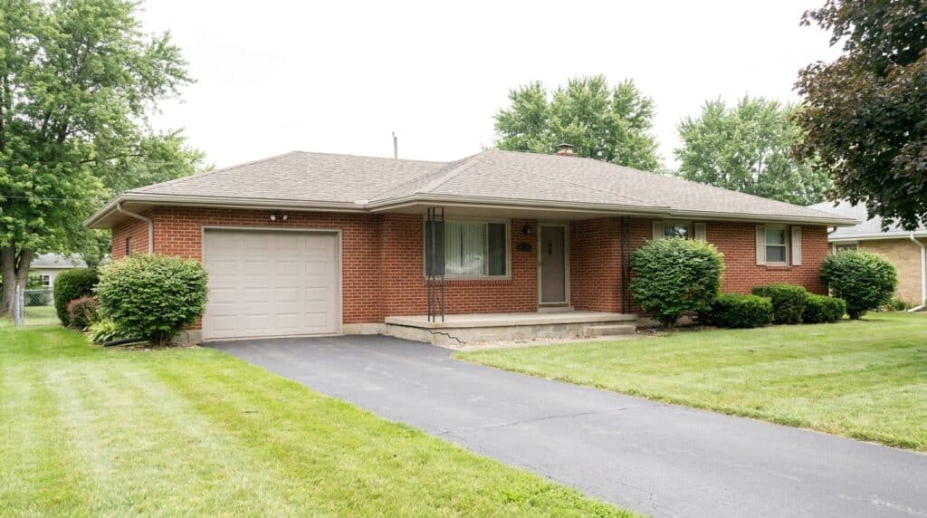 Charming brick house with spacious yard and garage, perfect for families.