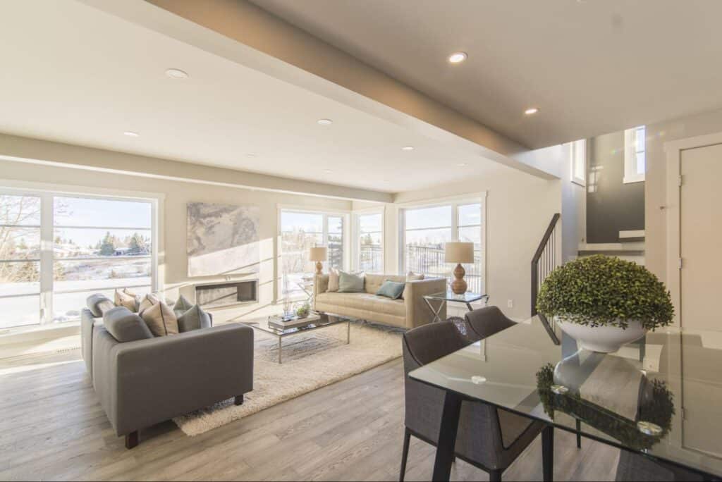Modern living room with natural light, stylish furniture, and elegant decor.